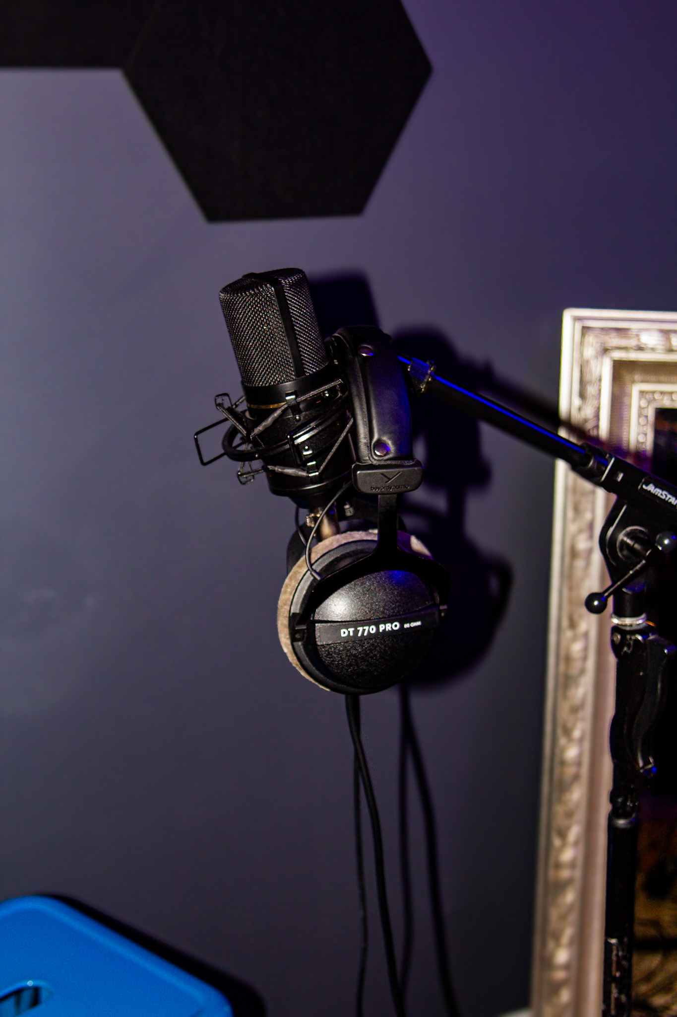 A large-diaphragm condenser mic and Beyerdynamic DT 770 Pro headphones on a boom arm